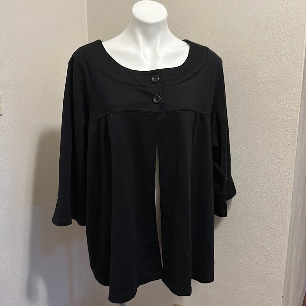 Gently worn 30/32 black 3/4 length sleeved jacket with slight ruffled cuffs.